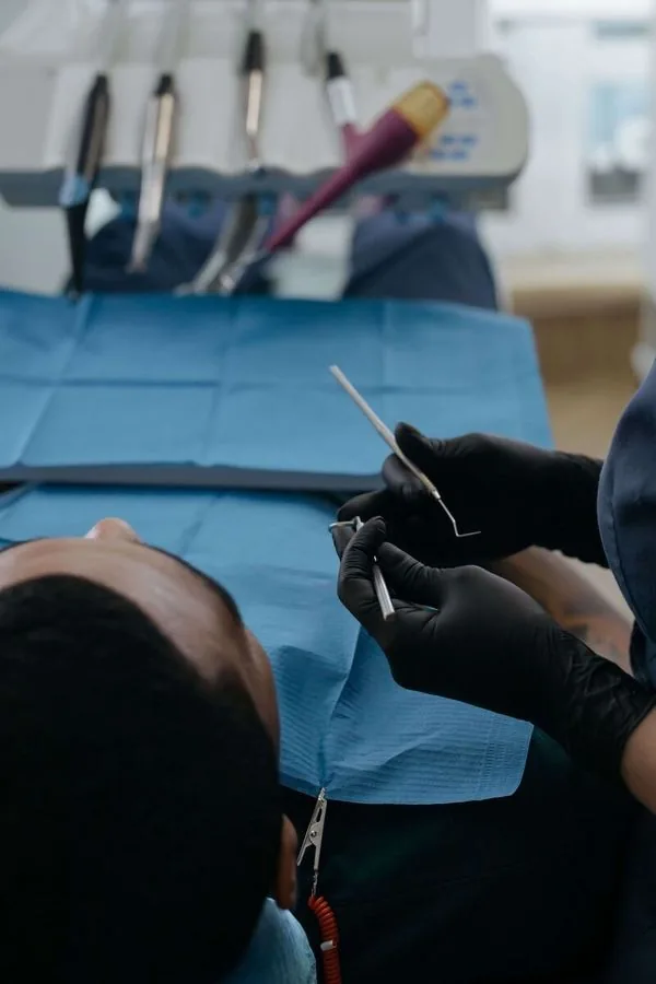 Dental hygienist providing concierge care to a patient at home